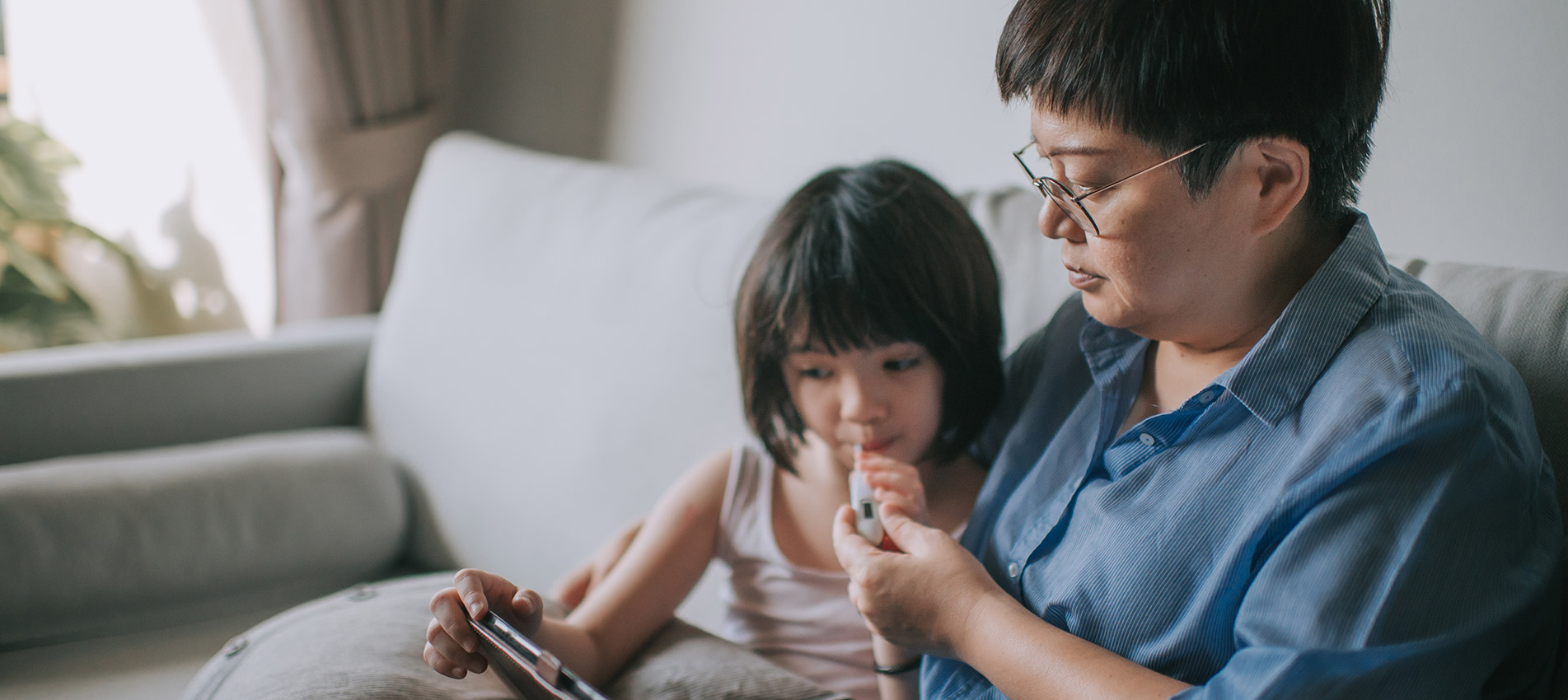 Telemedicine Telehealth Asian Chinese Mother Using Laptop Communicate With Doctor Pediatrician On Her Daughter Sickness