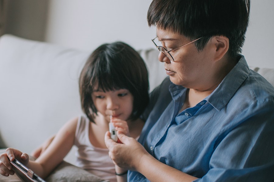 Telemedicine Telehealth Asian Chinese Mother Using Laptop Communicate With Doctor Pediatrician On Her Daughter Sickness