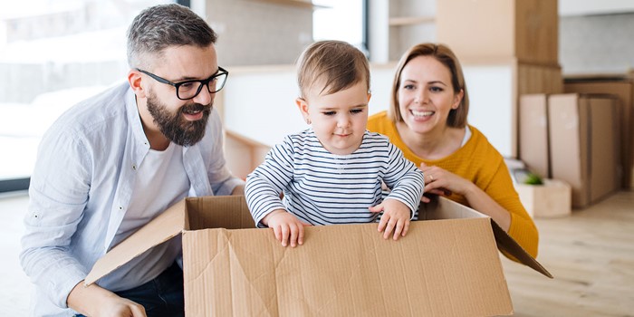 Young Family With A Toddler Girl Moving In New Home