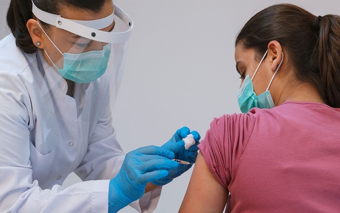Nurse Giving Covid 19 Vaccine To Patient