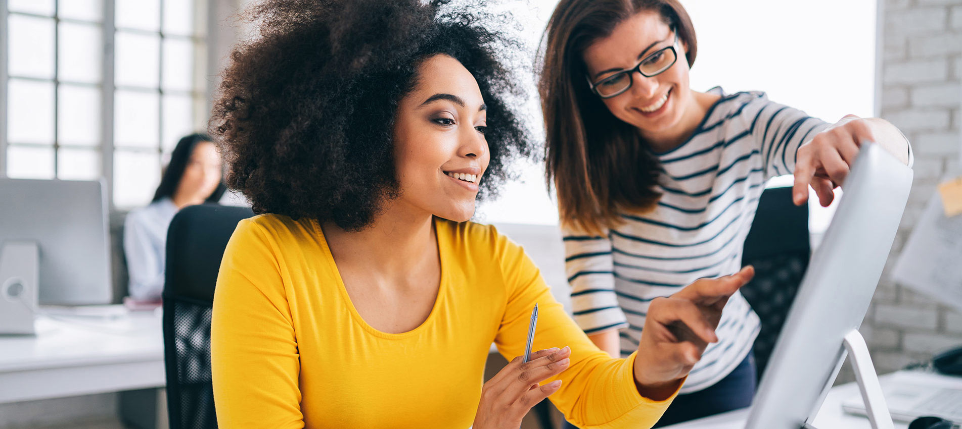 Afro Female Manager Discussing Business In Creative Office