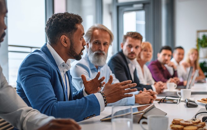 Executive Team Listening To Contrary Views From Colleague