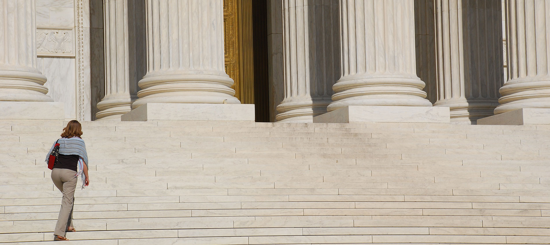 Woman Walking Up Steps Of US Supreme Court