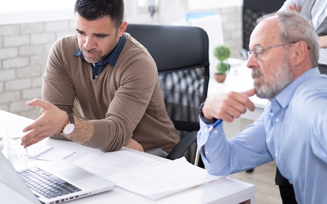 Coworkers Discussing A Project