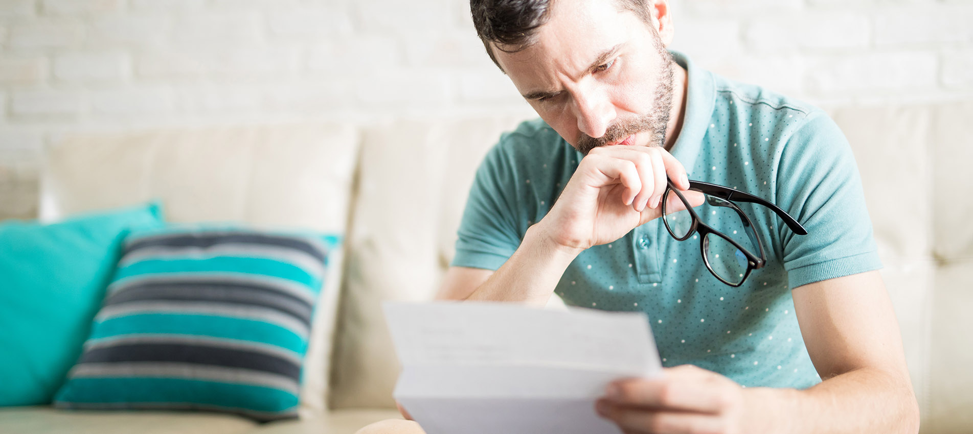Man Concentrated Reading A Letter