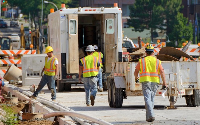 Construction Workers Working On Road Construction