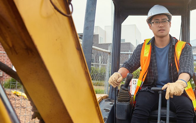 Construction Worker Operating Crane