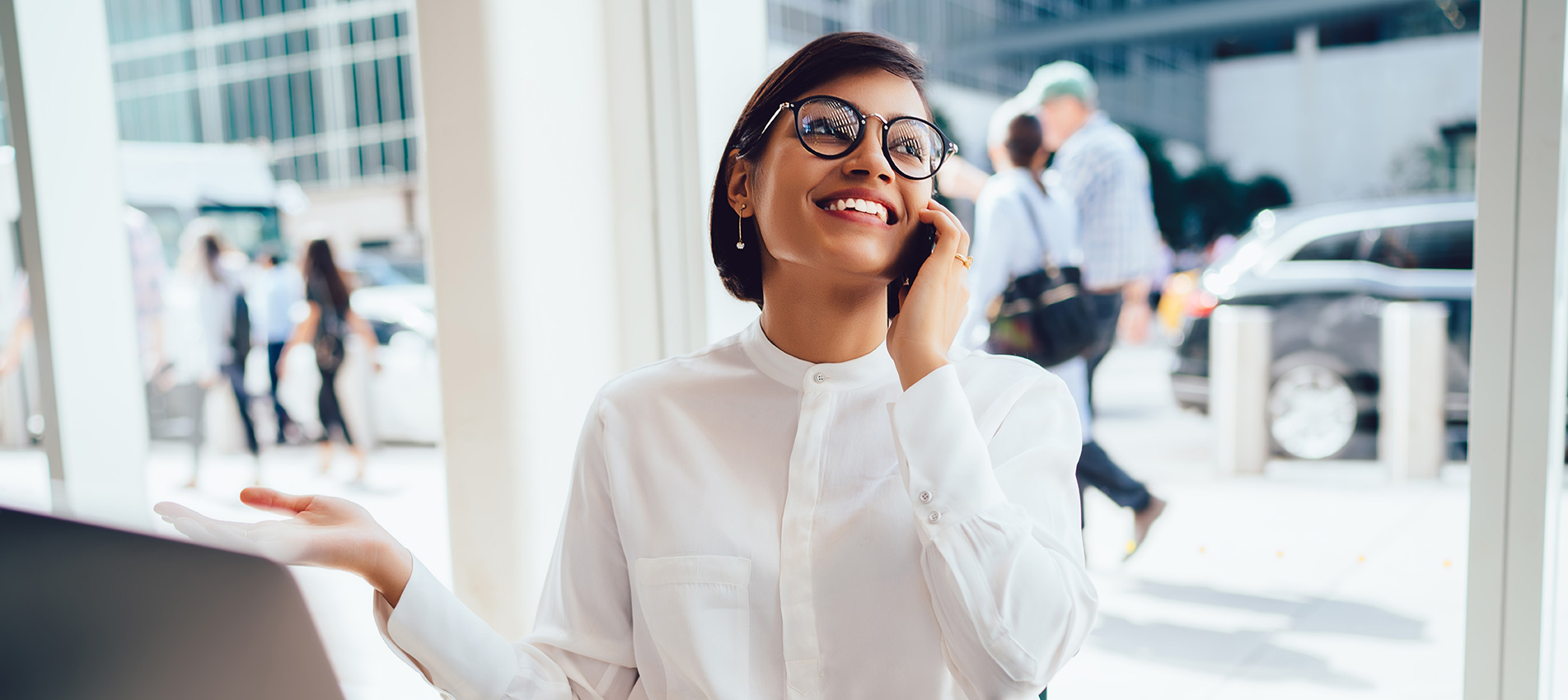 Cheerful Businesswoman Talking On Smartphone