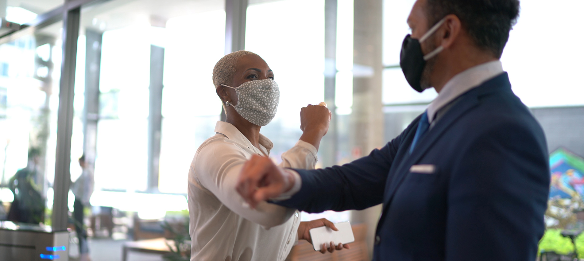 Business People On A Safety Greeting For Covid 19 On Office Lobby With Face Mask