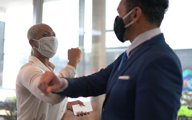 Business People On A Safety Greeting For Covid 19 On Office Lobby With Face Mask