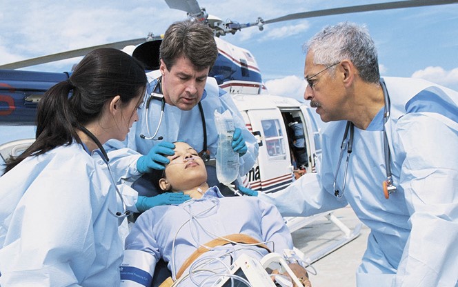 Nurses Transporting A Patient From A Medical Helicopter