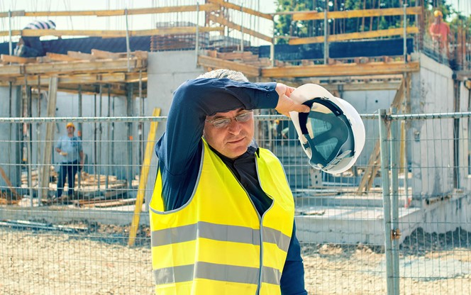 Tired Worker At The Construction Site