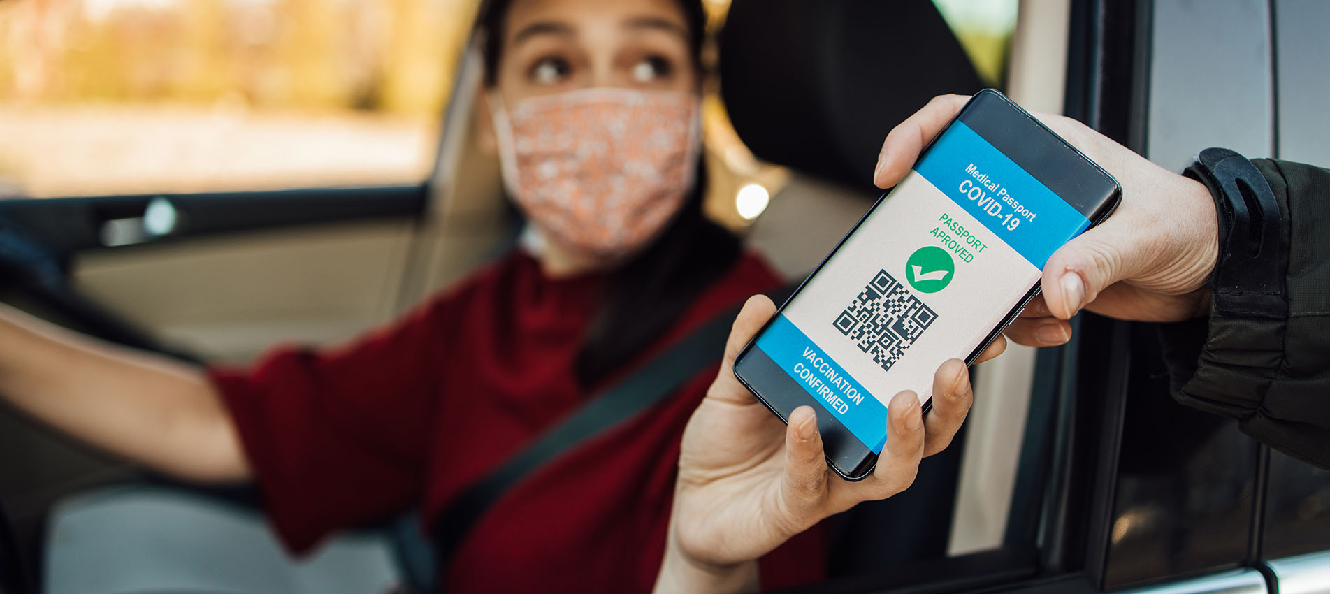 A Woman Showing Her Digital Covid Vaccine Certificate On Her Phone