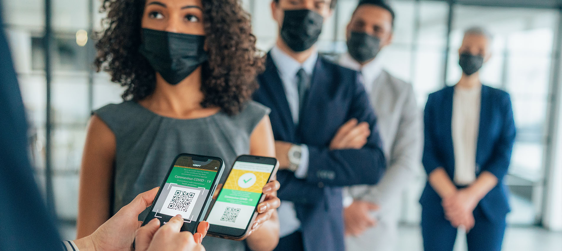 Business Woman Showing Her Digital Vaccination Card At The Office