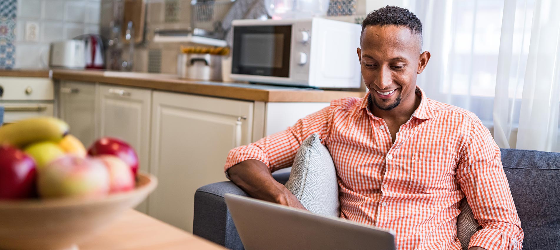 Afro Latino Men Working On A Laptop At Home