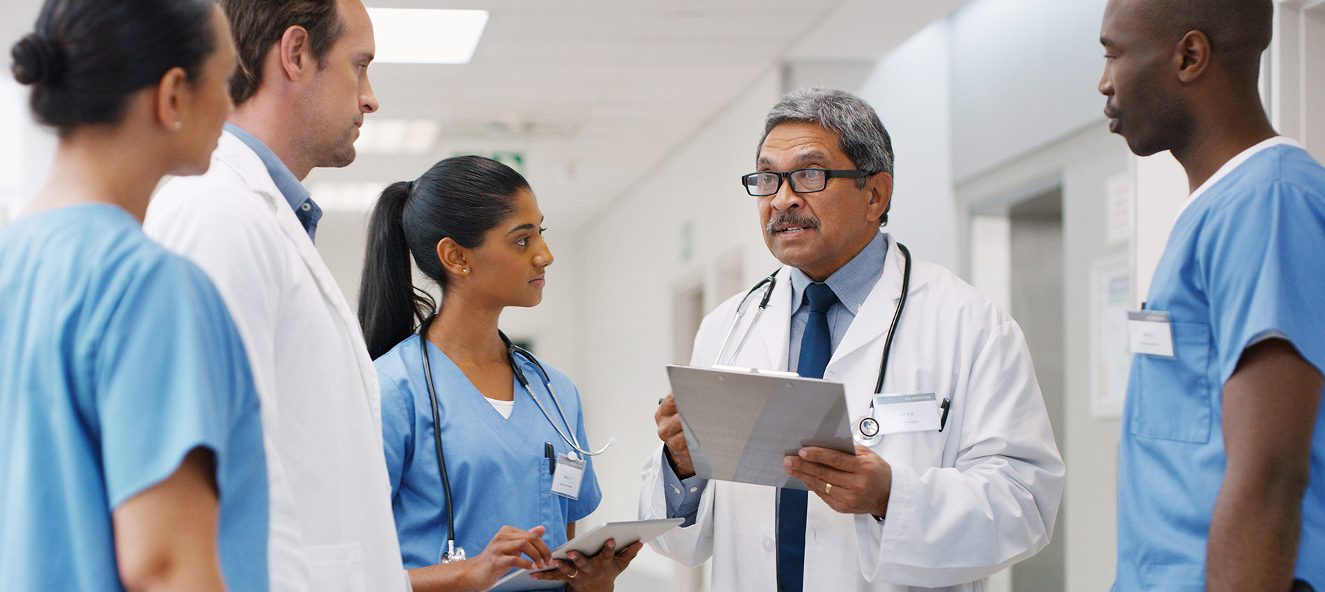 Group Of Medical Practitioners Having A Discussion In A Hospital