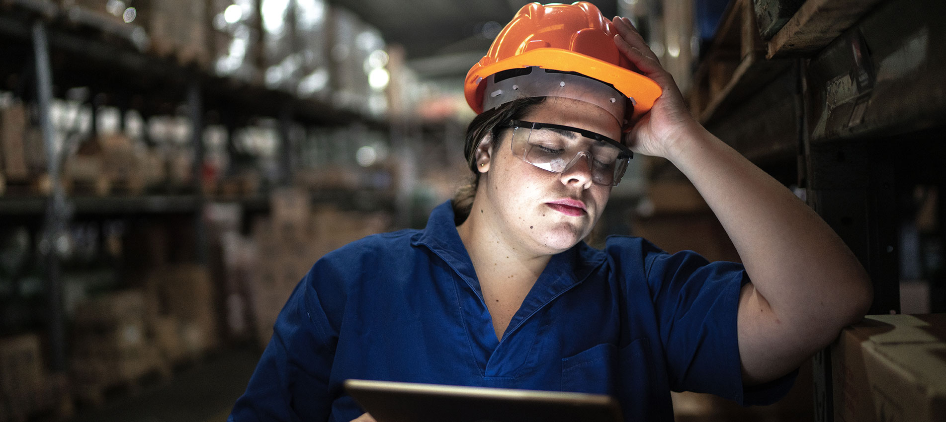 Worried Employee Working At A Warehouse