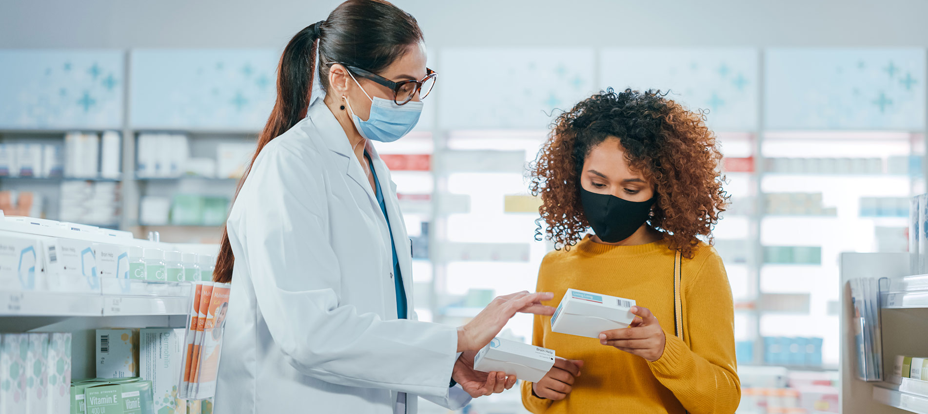 Pharmacist Helping Female Customer With Medicine Recommendation