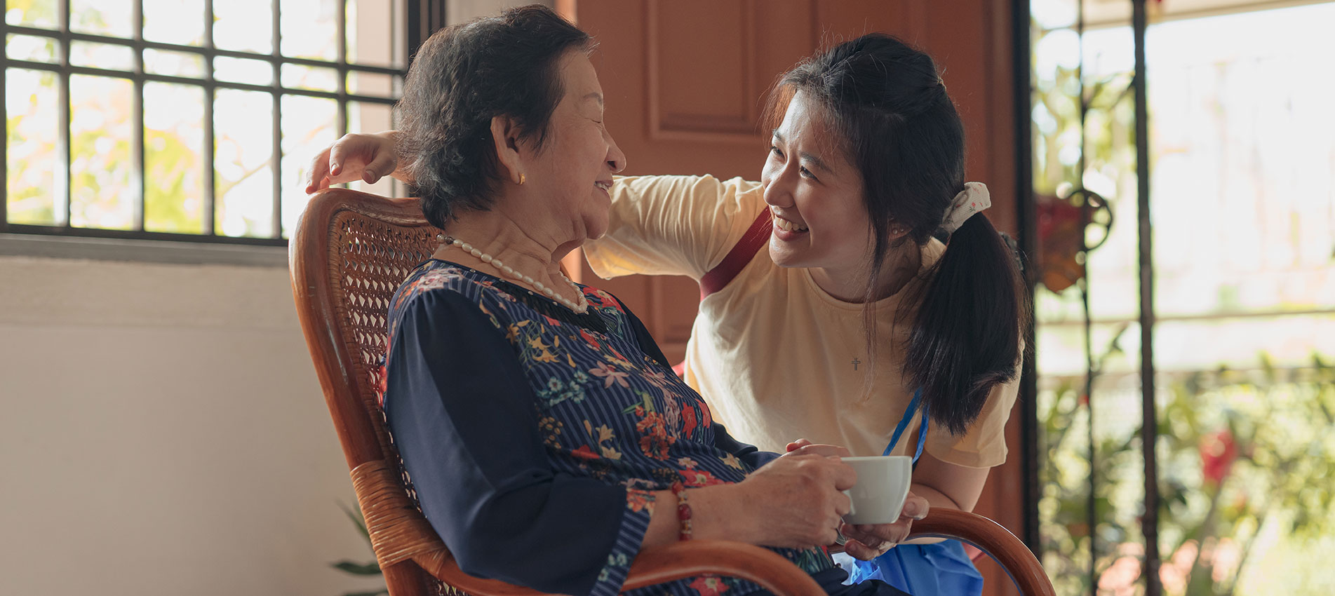 Asian Granddaughter Visiting Her Grandmother