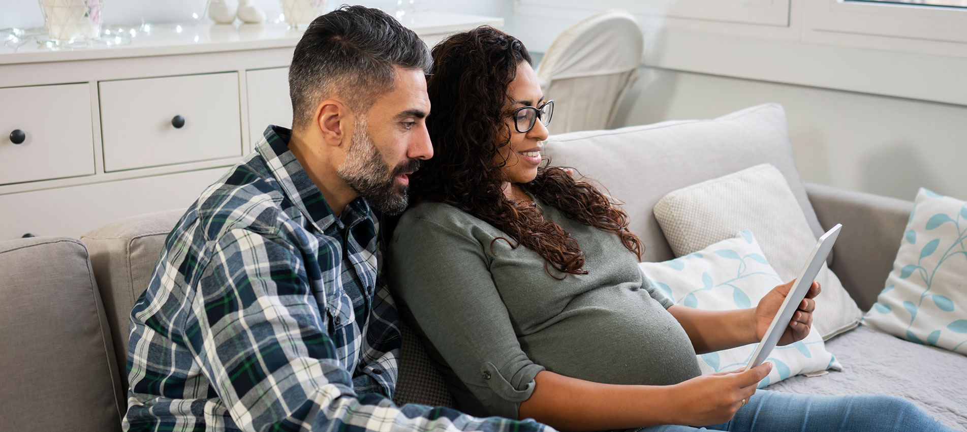 Mature Couple At Home Expecting Baby
