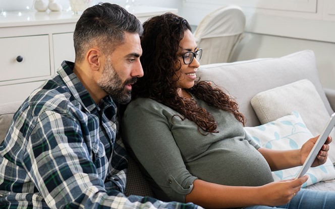 Mature Couple At Home Expecting Baby