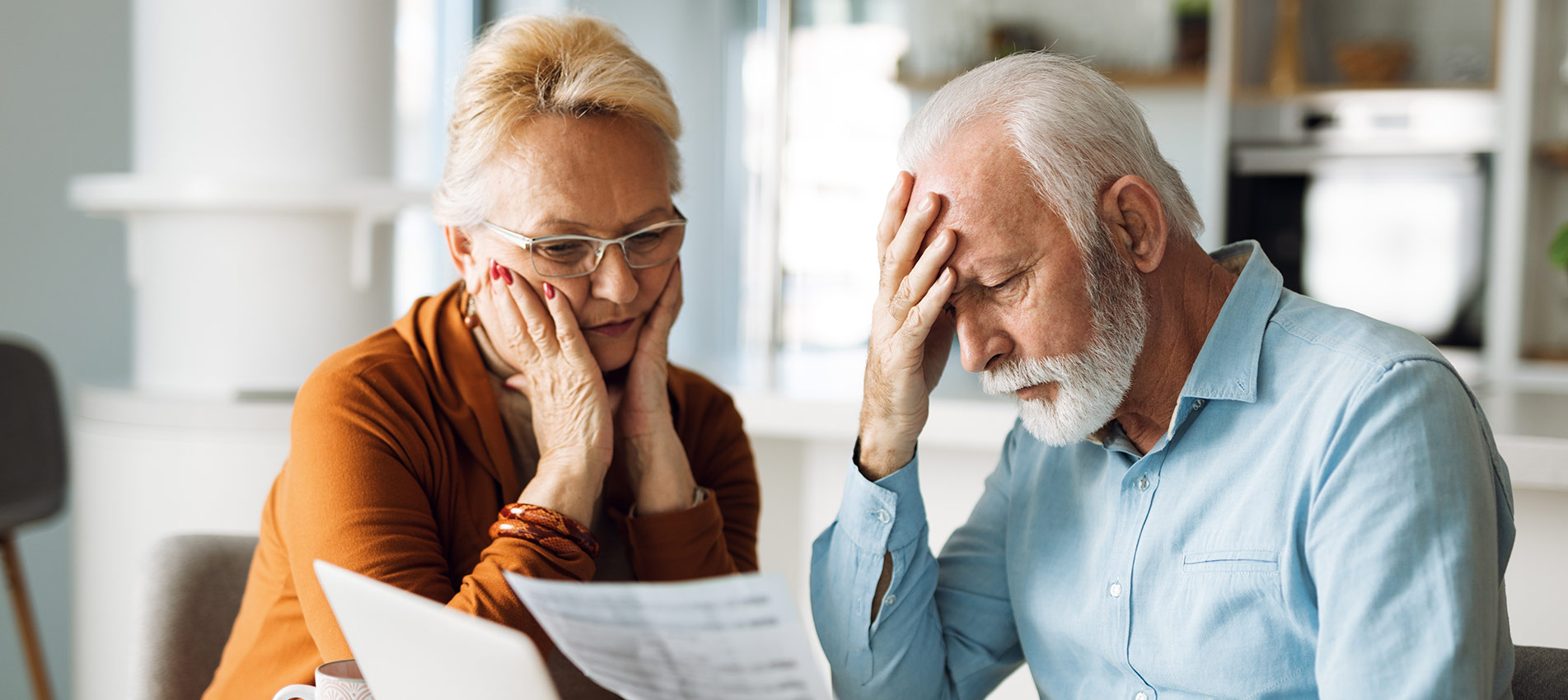 Frustrated Mature Couple Having Problems With Paying Their Bills Over Internet