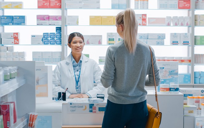 Pharmacist Helping Customer