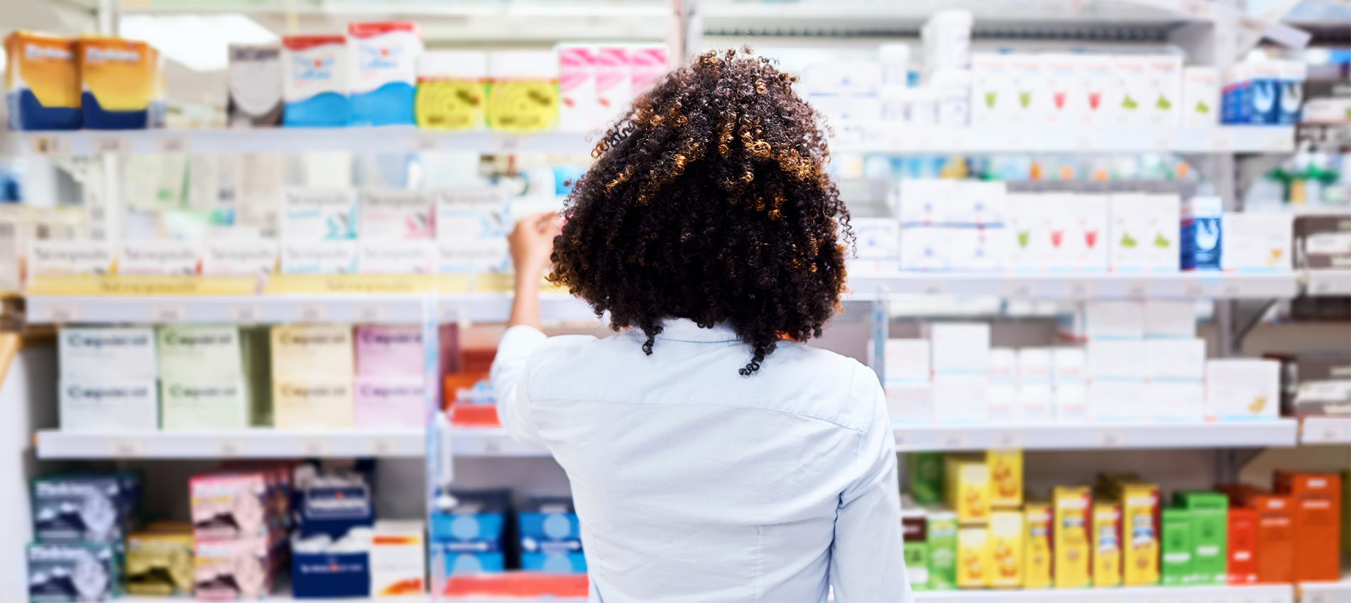 Lady At A Pharmacy Shelf