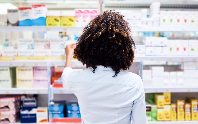 Lady At A Pharmacy Shelf