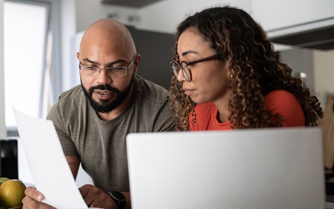 Couple Doing Home Finances Together At Home