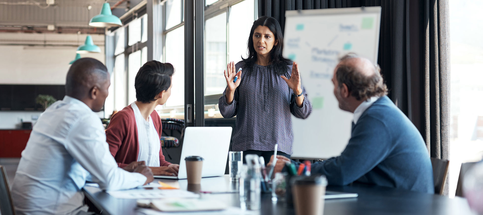 Businesswoman Presenting To Team