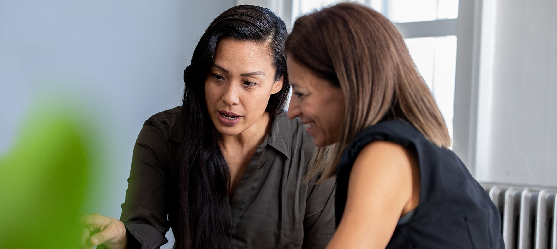 Women Discussing Something During Professional Meeting