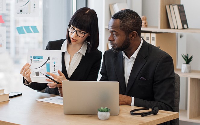 Project Managers Discussing Marketing Strategy Online Using Laptop