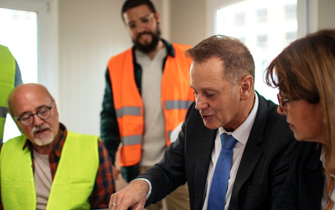Board Directors Having A Meeting With The Team In The Office At The Construction Site