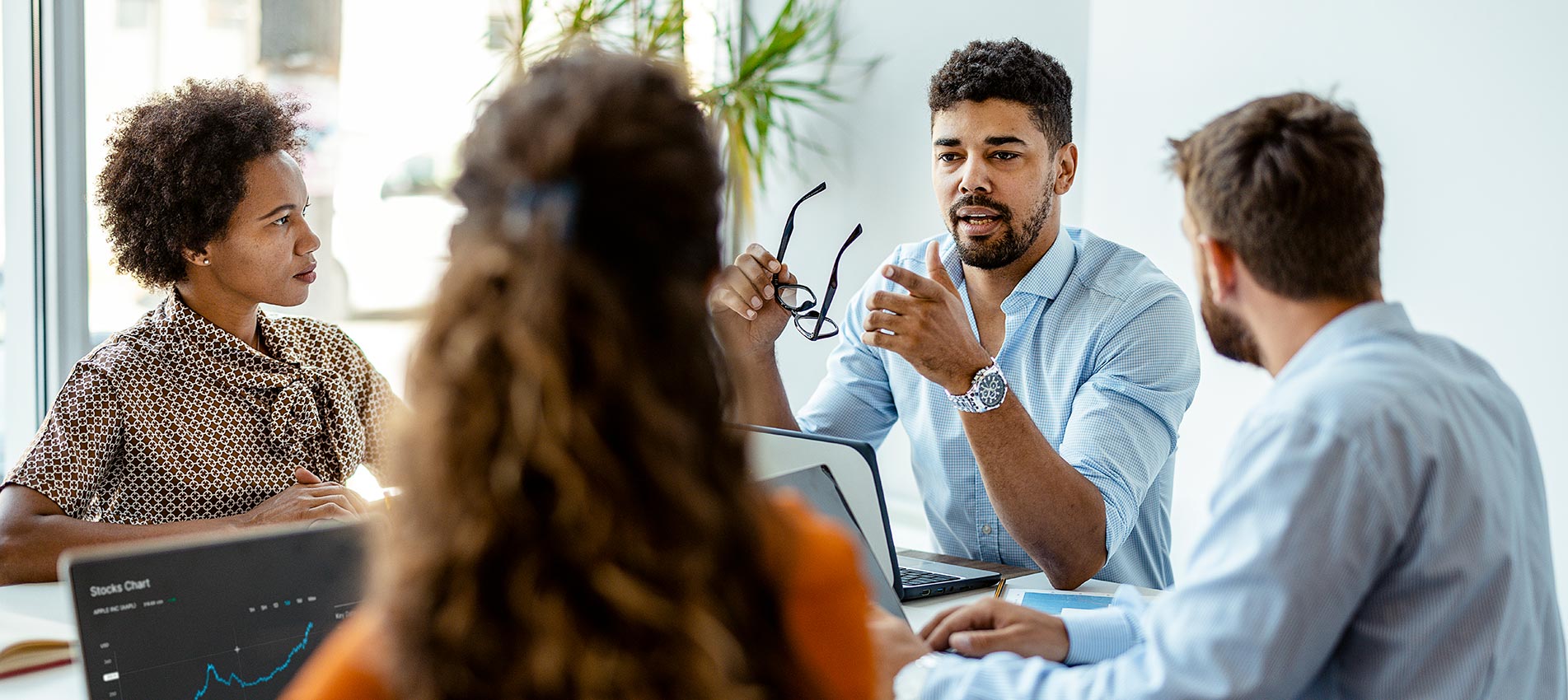 Young Modern People In Smart Casual Wear Discussing Business While Sitting In The Creative Office