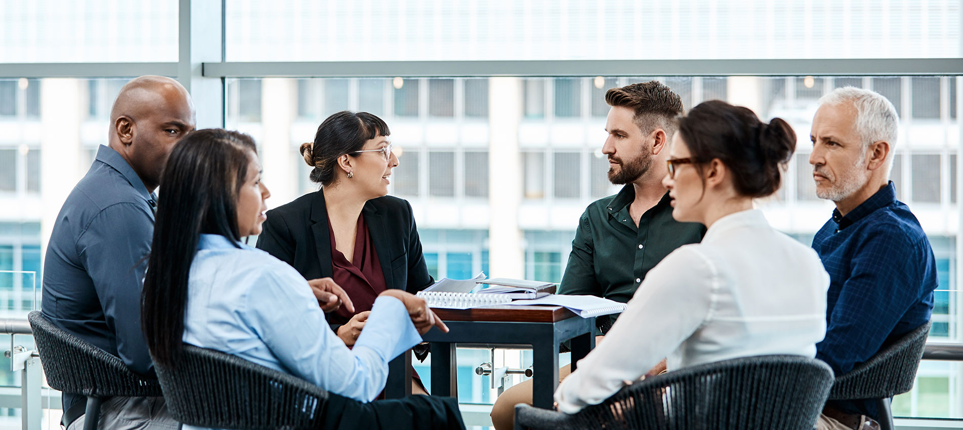 Group Of Businesspeople During A Boardroom Meeting At Work