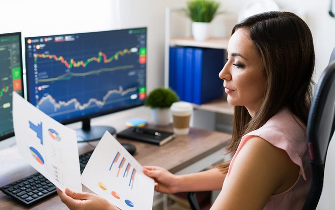 Business Analyst Looking At A Graph Chart