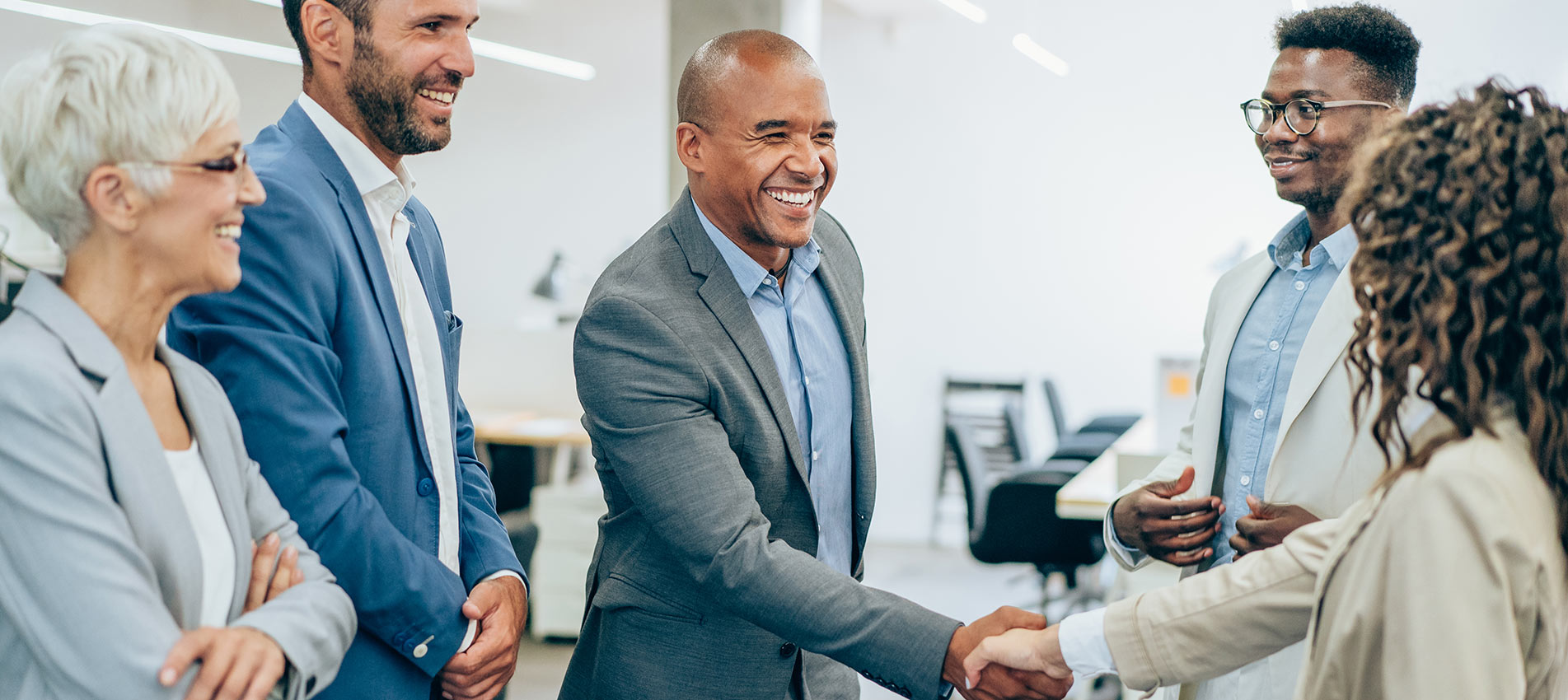 Business People Shaking Hands In The Office