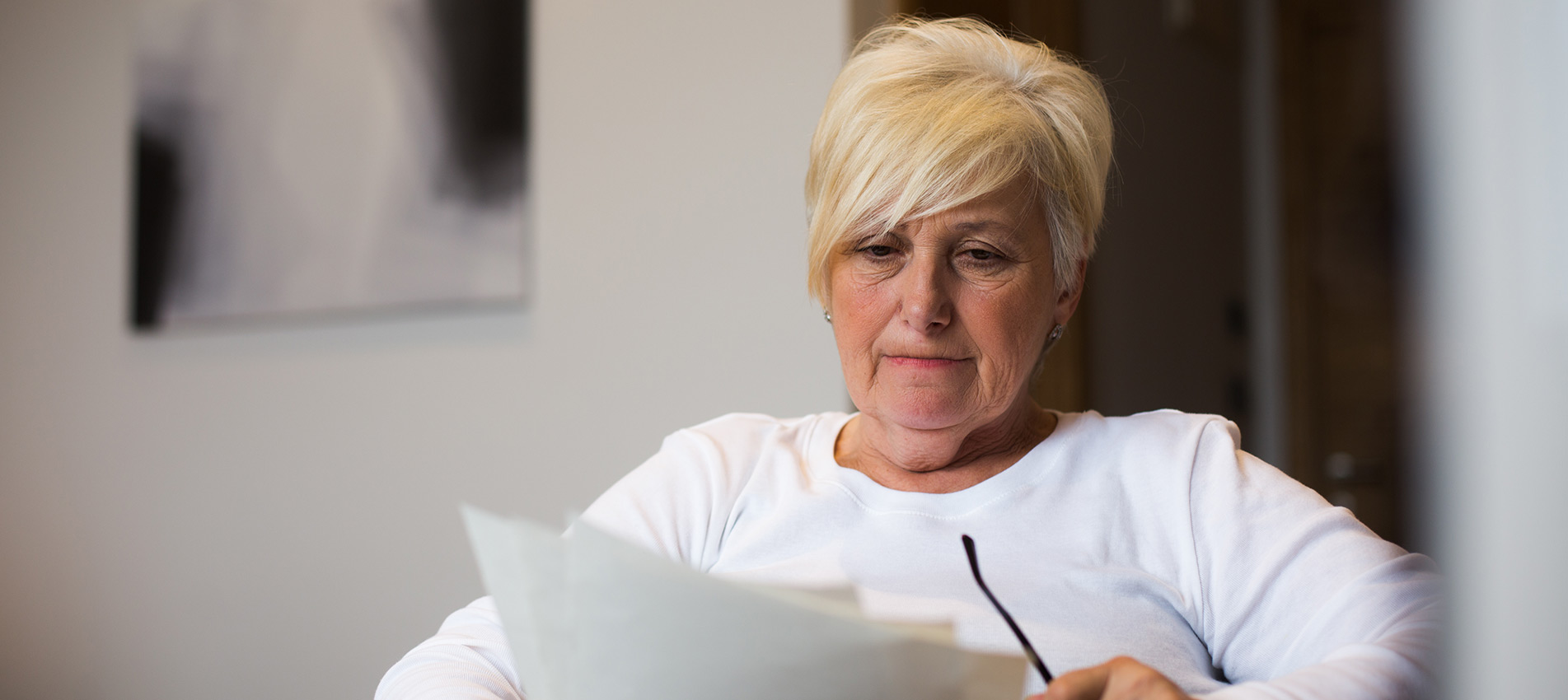 Senior Woman Reading Documents