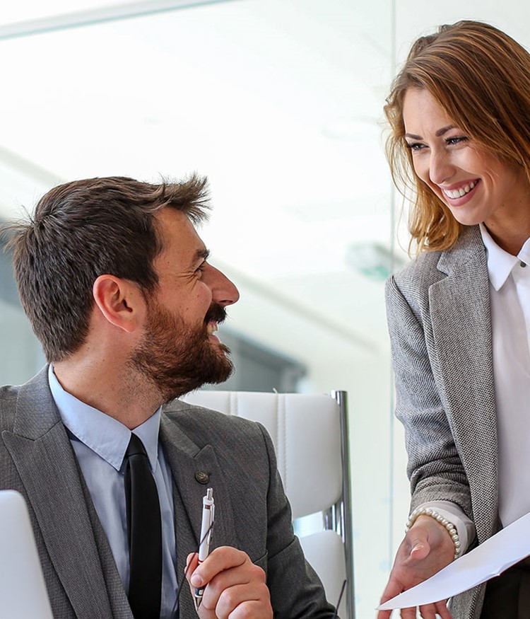 Two Employees Of The Company Consult About New Work Responsibilities