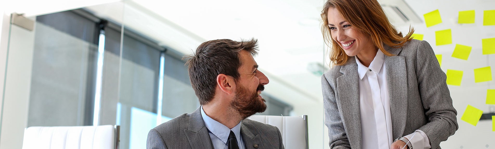 Two Employees Of The Company Consult About New Work Responsibilities