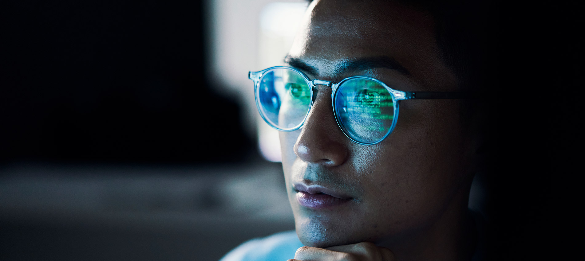 Asian Man Focus And Programming For Cyber Security