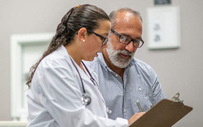 https://www.segalco.com/media/3507/a-female-doctor-sits-next-to-an-elderly-male-patient-reviewing-the-patient-chart-together.jpg?crop=0.22655748233782919,0,0.060499391424246846,0&cropmode=percentage&width=664&height=416&rnd=133419602230000000