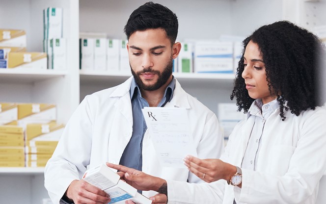 Healthcare Medicine And A Pharmacy Team With A Box Of Prescription Or Chronic Medication In A Drugstore
