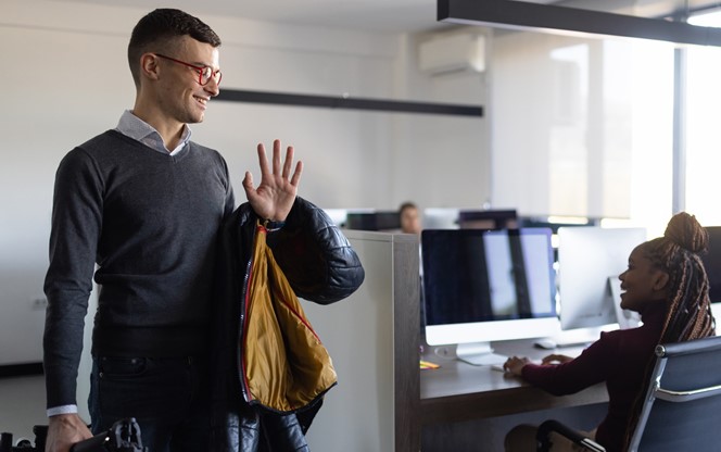 Man Waving To Co Workers (1)