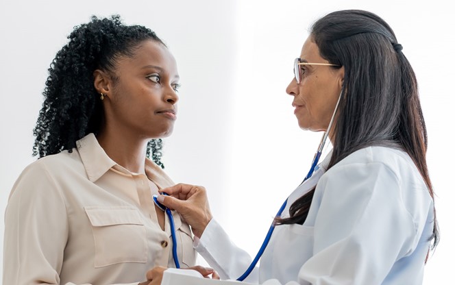 Medical Doctor Attending To A Female Patient