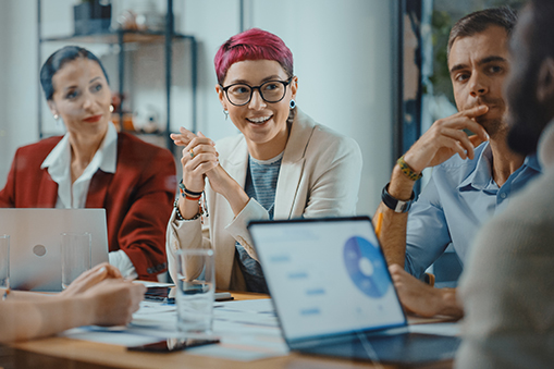 Beautiful Specialist With Short Pink Hair Talks About Firm Strategy With Diverse Team