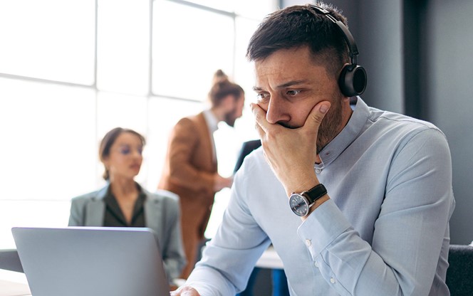 Worried Business Man Talking On A Video Call In A Modern Office