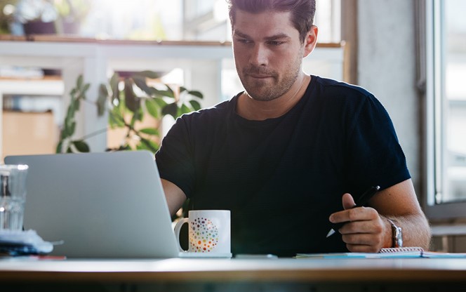 Man Working At Desk