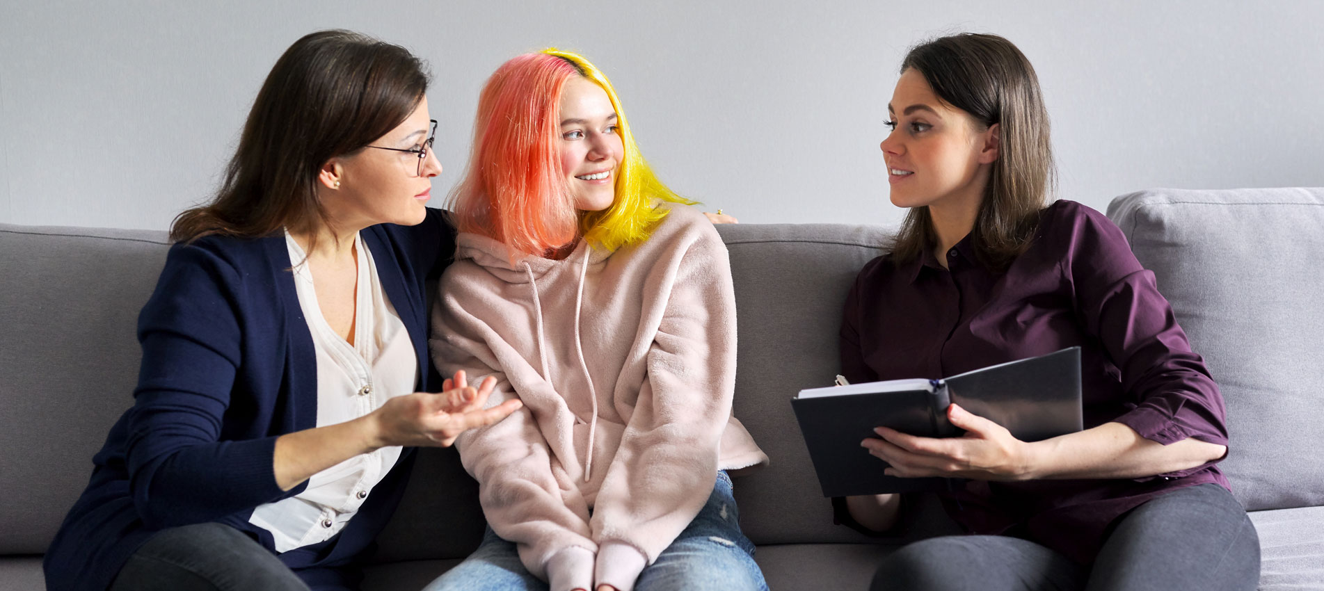 Family Mother And Teenage Daughter In Meeting With Psychologist